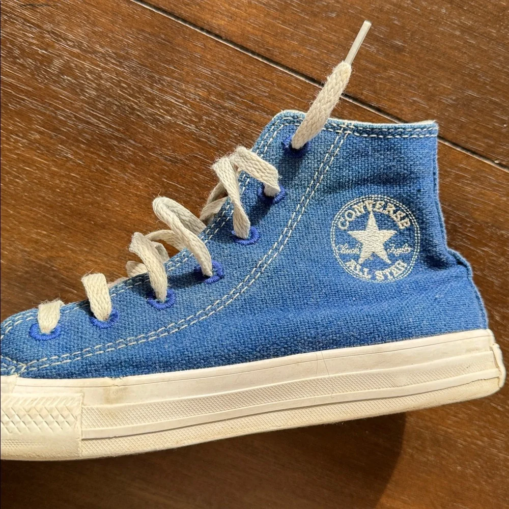 Size 2 Converse Chuck Taylor All Star Sneakers on blue